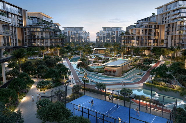 Vue nocturne immersive sur les résidences Crestlane entourées de verdure et d’un terrain de padel